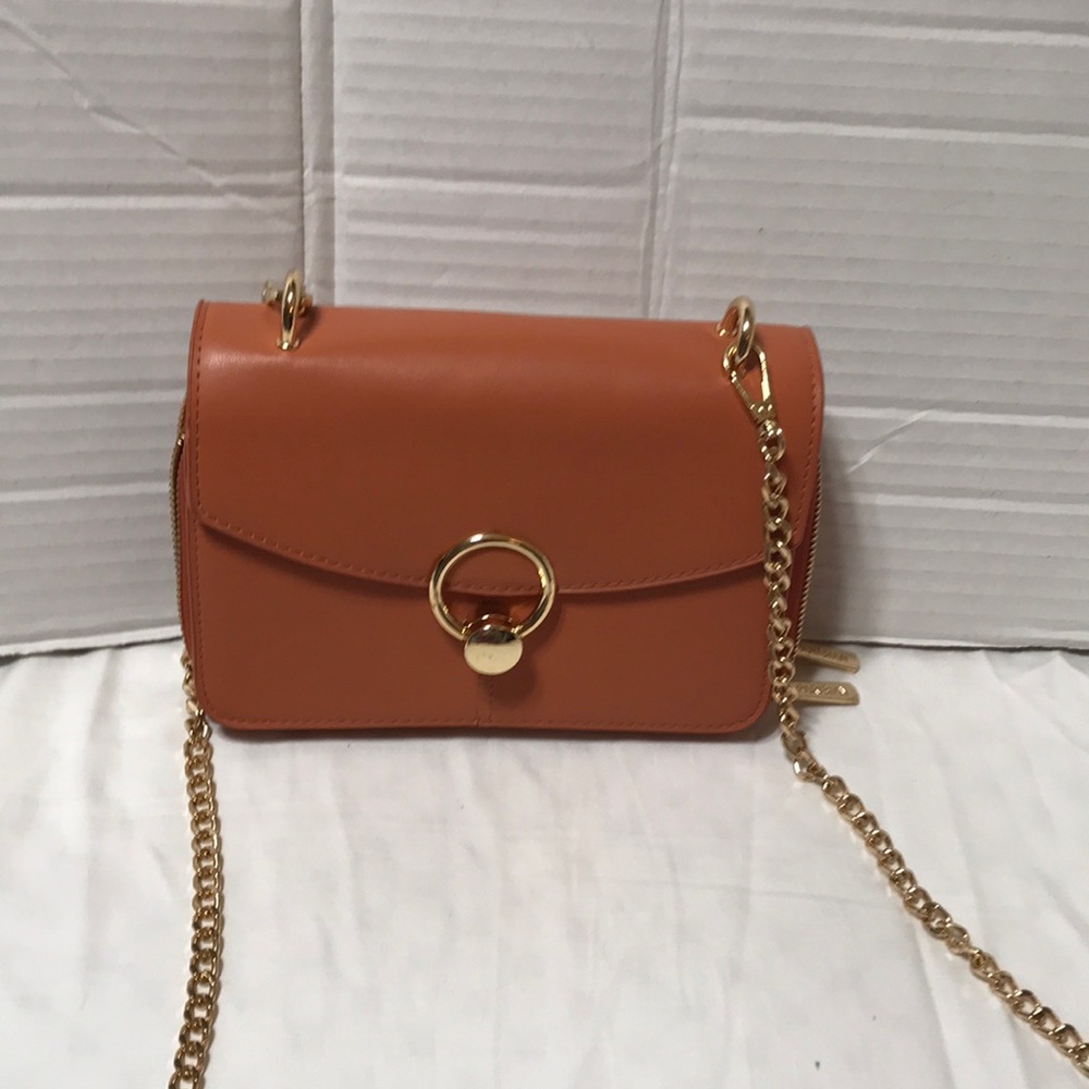 Parisian vegan leather crossbody bag with gold tone hardware. NWOT